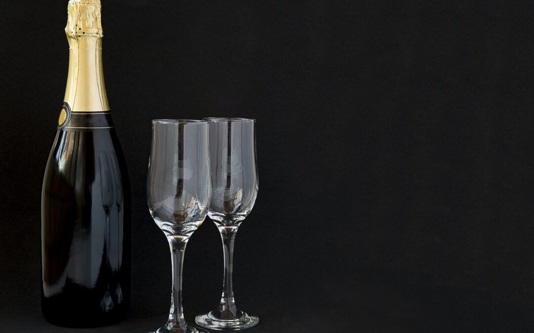 Champagne bottle with champagne glasses.
