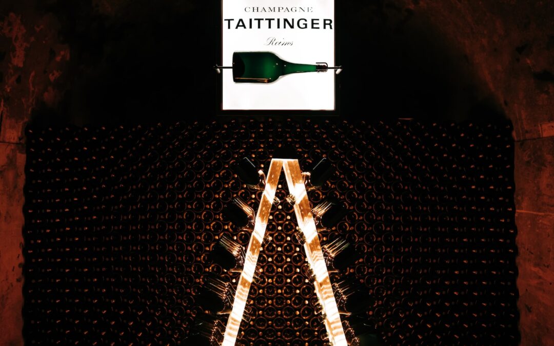 a large bottle of wine sitting on top of a metal rack